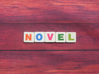 Word Novel on wood background
