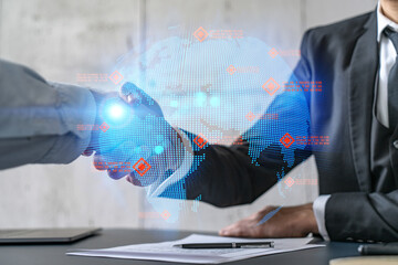 Double exposure of two businesspeople handshake and globe the earth hologram drawing background. Concept of international business. Formal wear.