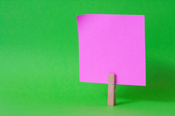 paper notes and clothespins isolated on orange background
