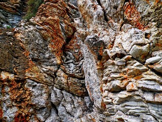 Rocks background stone texture pattern. Rocky ground stone structure. Natural stone texture rock wallpaper, background wall. Geologic rock formation. Cliff rocky background. Rocky old mountain texture