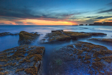 twilight over the rocky beach