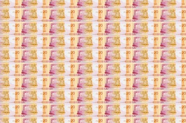 20 Belorussian rubles bills printed in money production conveyor. Collage of many bills. Concept of...
