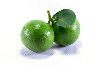 Thai lemons with green lemons, sour green lemons, separate on a white background and copying area and text area.