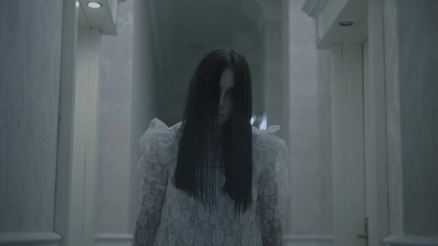 Creepy woman in a hotel corridor, ghost of bride, paranormal abilities, devil