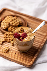 
Delicious breakfast. Coffee mousse with raspberries and biscuits.