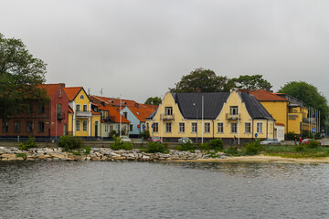 Sweden - August 14, 2011: Beautiful, little, cozy and multicolored buildings near the sea (at the pier)