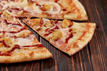 tasty pizza on the wooden background