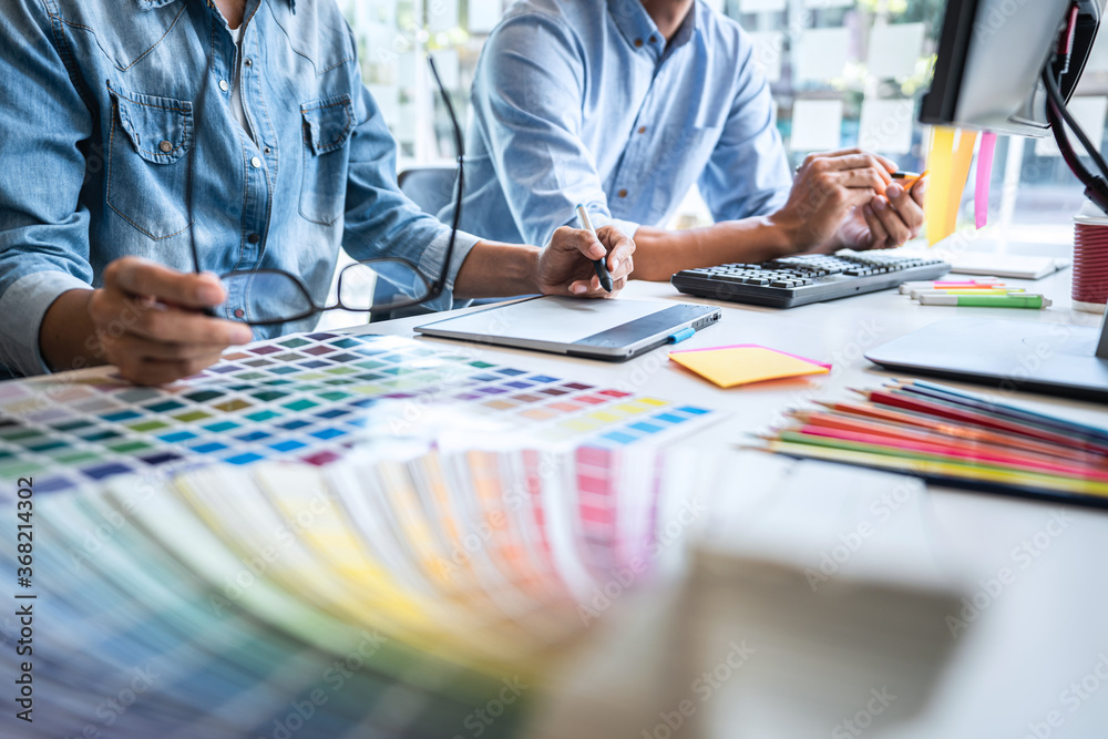Poster two creative graphic designer working on color selection and color swatches