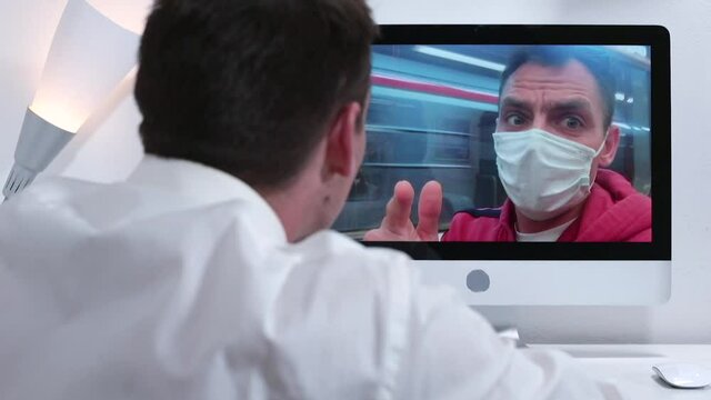 A video call masked man from a subway train. Communication between employee and manager during working hours. Discussion and spinning of the solution.
