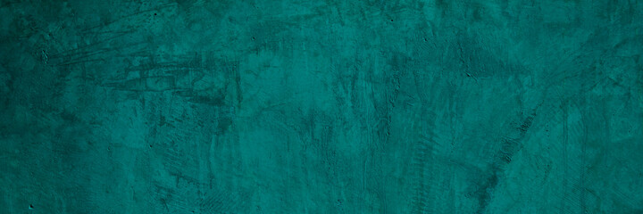 Texture of a old grungy green concrete wall with cracks as a background or wallpaper