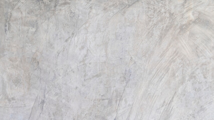 Texture of a old grungy gray concrete wall with cracks as a background or wallpaper