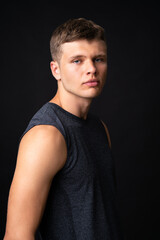 Obraz premium Portrait of young man over isolated black background