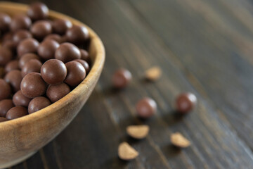 Tibetan medicine herbal pills in wooden bowl