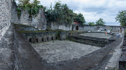Ruins of the theater destroyed by the eruption of the volcano the montagne pelée
in Saint Pierre in Martinique - obrazy, fototapety, plakaty