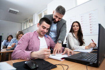 Fototapeta premium Students in drivers school learning traffic rules