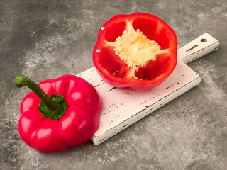 halved red bell pepper on a cutting board