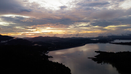 Aerial view of Kenyir Lake during blue hour sunrise.