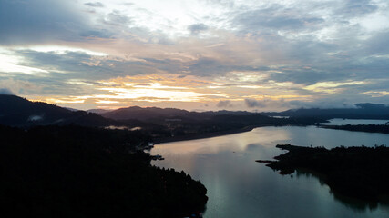Aerial view of Kenyir Lake during blue hour sunrise.