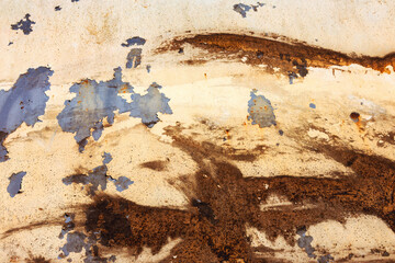 Abstract creative background of chaotic strokes of old cracked paint on concrete wall. Old surface with traces of paint, weathered, scratches and cracks for design