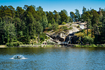 Waterfall cascading over rocks in Sapokka landscaping park Kotka, Finland.