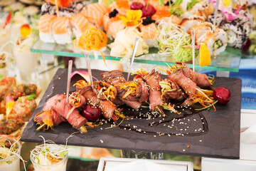 Assortment festive appetizers on the plate, selective focus. Festive buffet. As a photo, for the menu of restaurants, cafes and promotional items.