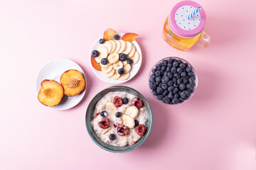 porridge, fruit and berries as healthy yummy breakfast concept