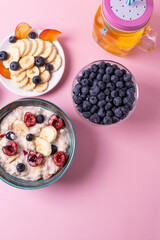 porridge, fruit and berries as healthy yummy breakfast concept