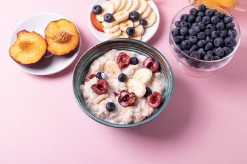 porridge, fruit and berries as healthy yummy breakfast concept