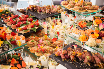 Assortment festive appetizers on the plate, selective focus. Festive buffet. As a photo, for the menu of restaurants, cafes and promotional items.