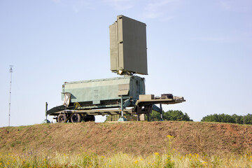 Military radar station element, which stands on a dais among the natural landscape