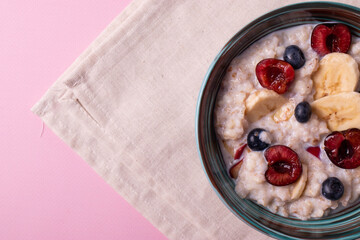 porridge, fruit and berries as healthy yummy breakfast concept
