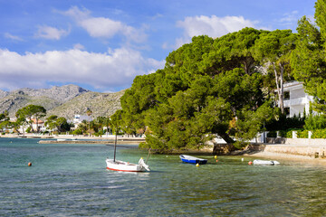 Fototapeta na wymiar The beautiful coast of the Mediterranean sea in Pollenca village. Popular tourist destination on Mallorca island, Spain