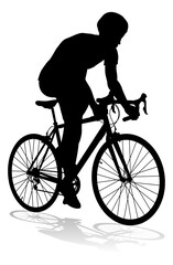 Bicyclist riding their bike and wearing a safety helmet in silhouette