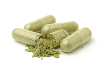 Close up,Andrographis Paniculata powder and capsules (Herbal capsules) isolated on a white background..