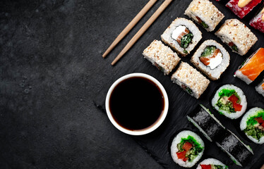Set of sushi on a stone background with copy space for your text