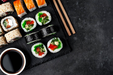 Set of sushi on a stone background with copy space for your text