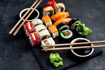 Set of sushi on a stone background. Dinner for two