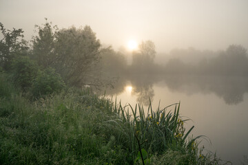 Morning fog over the river at sunrise. Blurred background.