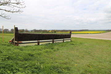 Fototapeta premium A brush hurdle on a racecourse for steeple chasing in Dorset, England, UK.