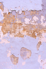 Vertical photo of wall shabby from old pink pastel paint. Grungy background