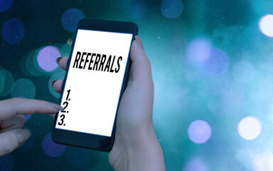 Conceptual hand writing showing Referrals. Concept meaning act, action, or an instance of referring...