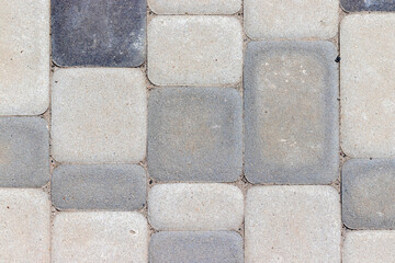 Outdoor concrete floor tiles background texture in different shades of gray