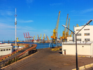 Fototapeta na wymiar Odessa, Ukraine - July 6, 2016: Container cranes in cargo port terminal, cargo cranes without job in an empty harbor port. A crisis. Defaulted paralyzed entire economy of state, in the EU candidate