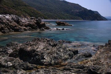 Long exposure of the sea and rocks on the coast of the Mediterranean Island of Corsica.  Nonza.
