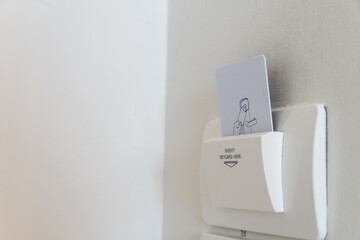 Electronic Keycard holder insert in hotel room. Concept for resort and automation room