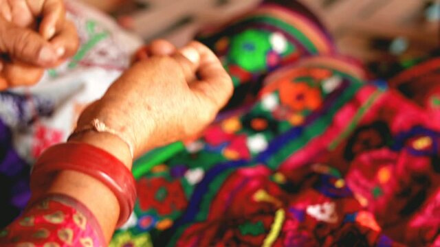 Girl doing embroidery,girl doing hand embroidery stiching at home,Young girl doing some needlework, selective focus,
