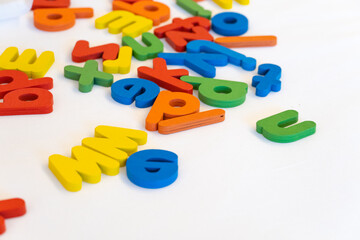 Naklejka premium Colorful wooden alphabet on white background. Children toy for education.
