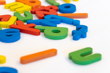 Fototapeta premium Colorful wooden alphabet on white background. Children toy for education.