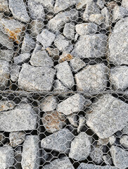 Many Rock under net. Background for raw loft material.