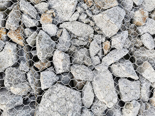 Many Rock under net. Background for raw loft material.